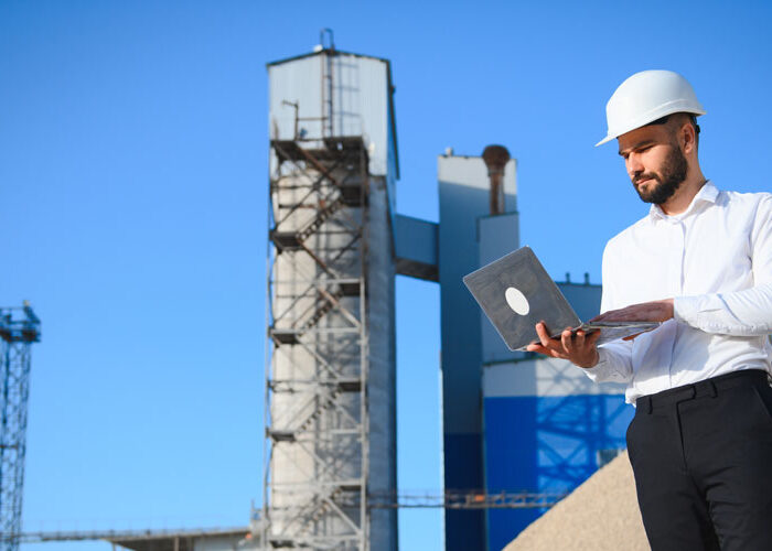 Cement manufacturing plant with digital overlay showing SAP Business One ERP dashboard and Azure cloud integration