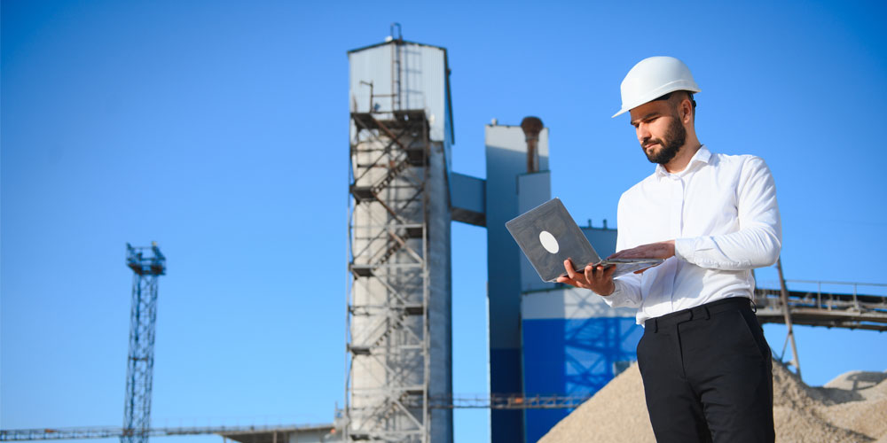 Cement manufacturing plant with digital overlay showing SAP Business One ERP dashboard and Azure cloud integration