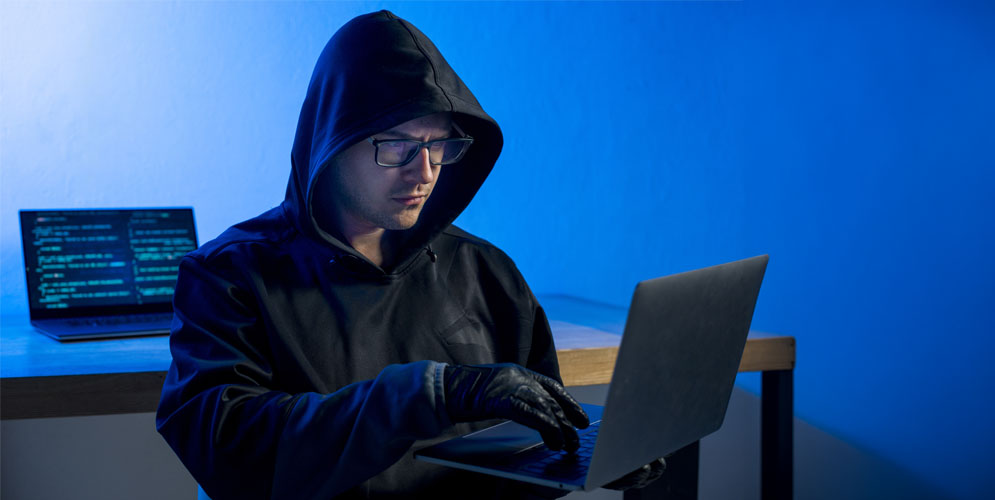 Security operations analyst reviewing dark web monitoring intelligence alerts for exposed corporate credentials on a SOC dashboard